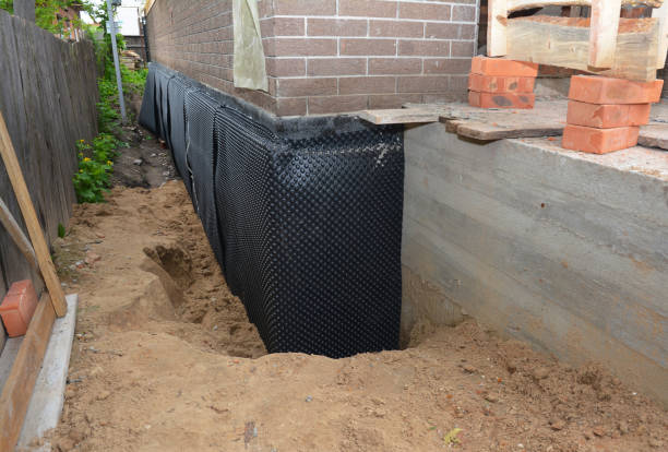 Happy homeowners after waterproofing job in Helenville